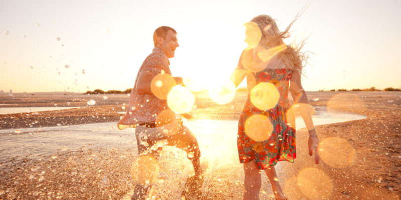 couple running on the beach